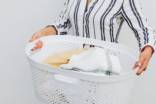 a-person-holding-laundry