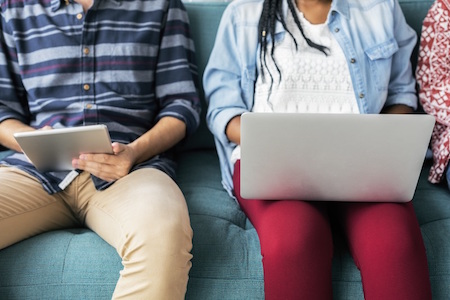 people-sitting-couch-laptop-tablet